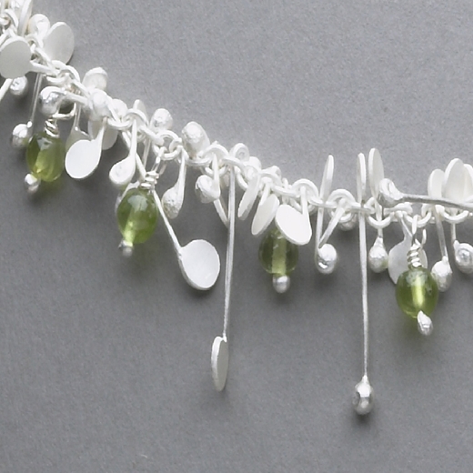 Blossom wire necklace with peridot, satin