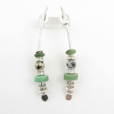 Large green arc earrings