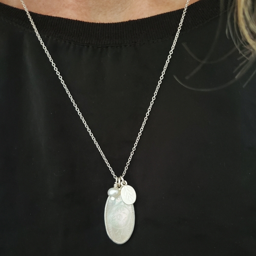 Mother of pearl cluster pendant worn