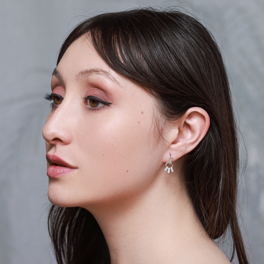 Pharaos triple drop earrings silver on model