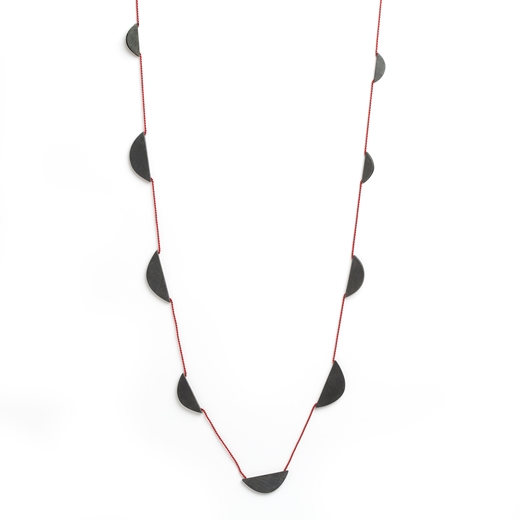 Nine boat necklace on red silk