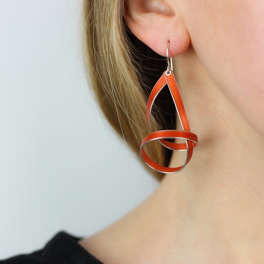 Orange short drop ribbon earrings worn