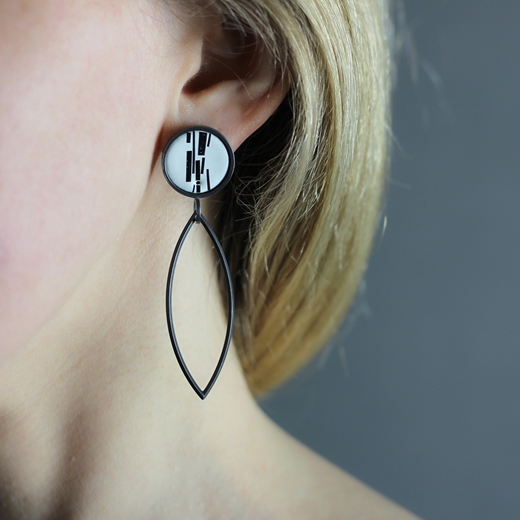 Enamel 'Shred marked' long leaf earrings worn