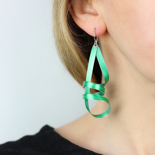Green long ribbon drop earrings worn