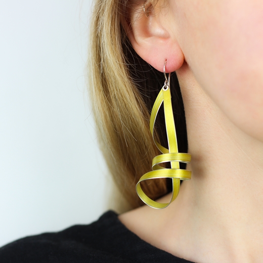 Yellow long ribbon drop earrings worn