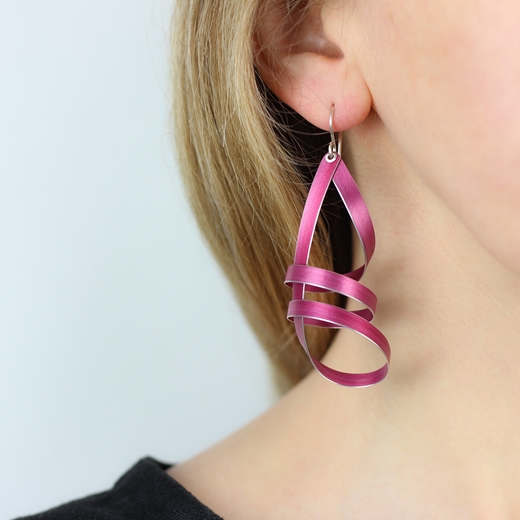 Pink long ribbon drop earrings worn