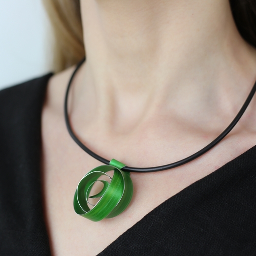 Lime wide ribbon coil pendant worn