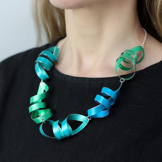 Green, turquoise blue and jade five long ribbon necklace worn