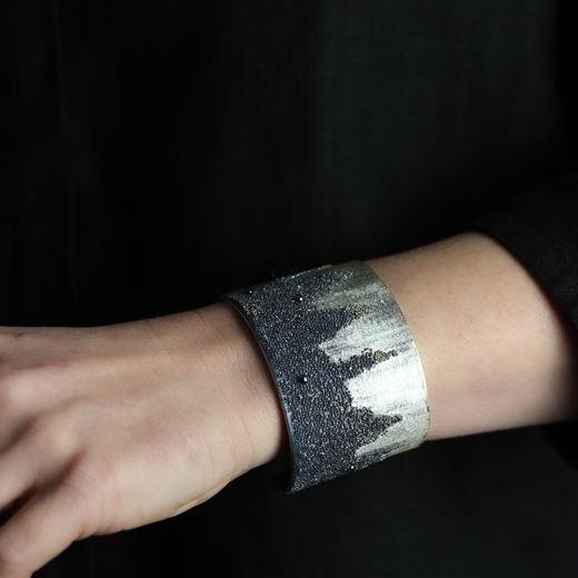 Volcanic Treasure black & White Cuff with Pearls worn