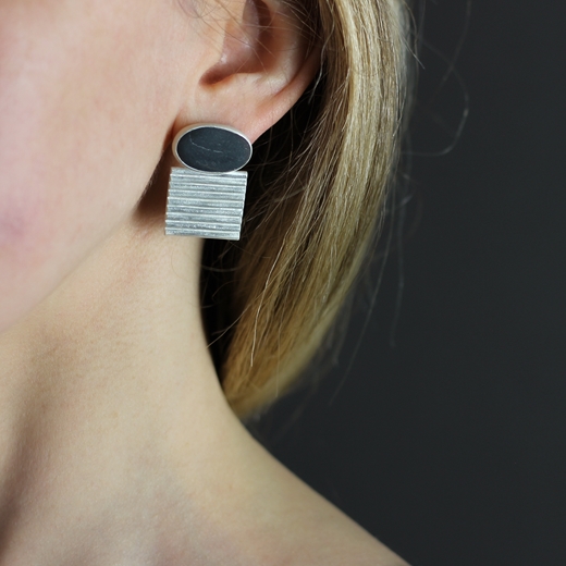 Pebble and ridged earrings - worn