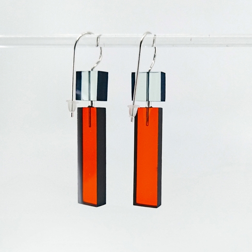 construction 1 earrings aqua and orange long on glass