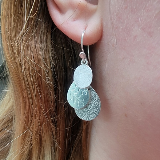 Falling leaf earrings worn