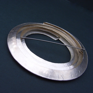 Circle silver brooch