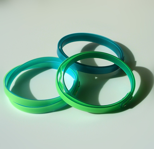 group showing thin lime green bangle and two other bangles